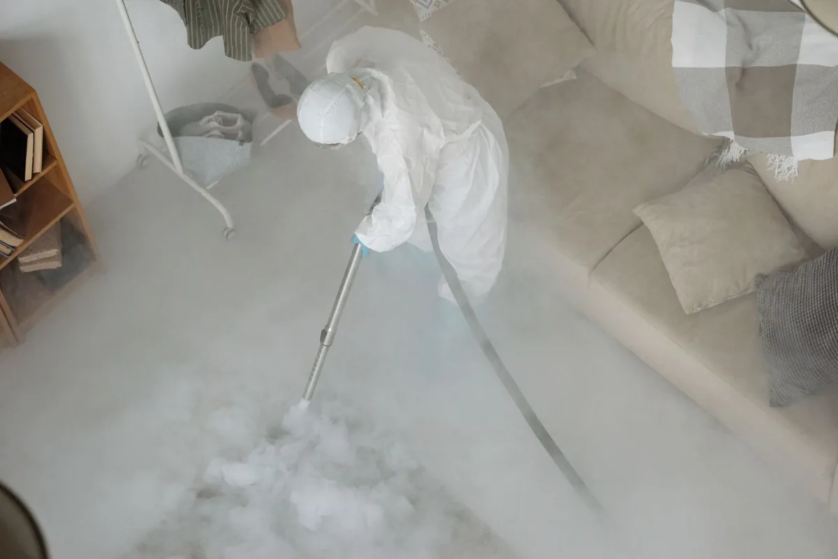 Biohazard cleanup technician in protective equipment, Colonie, NY